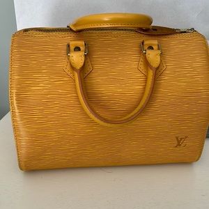 Authentic Louis Vuitton yellow ESP in great condition sp1915 is the code
